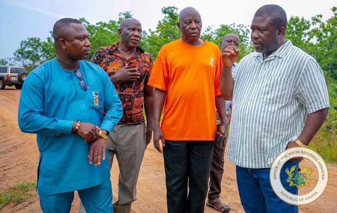 • Mr James Gunu (right) with Mr Jerry Ameko (left) inspecting the land for the industrial park at Adaklu